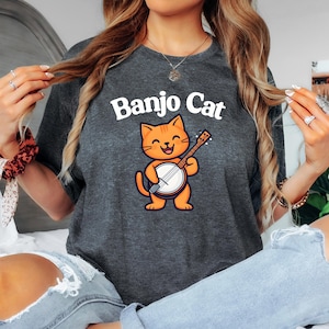 Banjo Cat Cartoon Animal Print Graphic Tee Funny Unisex Musician Shirt, Cat Playing Banjo, Banjo Player Gift, Bluegrass Shirt, Graphic Tee