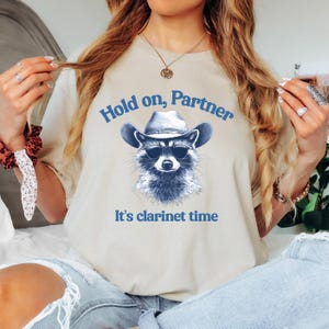Hold On Partner its Clarinet Time Funny Raccoon Cowboy Unisex T-Shirt Funny Clarinet Shirt Clarinetist Gift Bass Clarinet Retro Animal Print