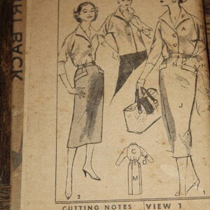 May include: A vintage Advance Printed Pattern envelope 8182 featuring black and white line drawings of a collared shirt and a skirt. The illustration shows two figures wearing the garments, with one holding a handbag. Text includes Cutting Notes and View 1 35" fabric without.