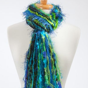 All fringe knotted scarf in shades of black, turquoise and lime green