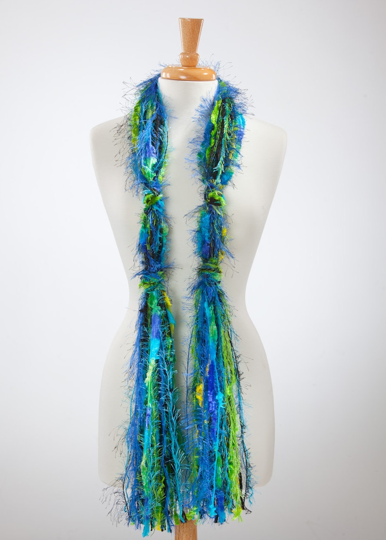 unique all fringe scarf made with yarns in shades of black, lime and turquoise.