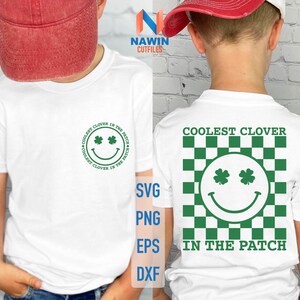 May include: White t-shirt with a green clover graphic and the text "Coolest Clover in the Patch".