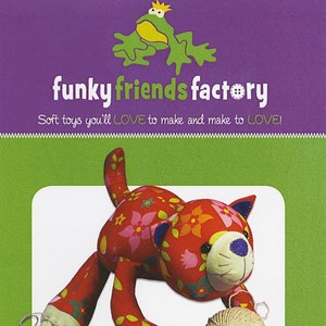 May include: A soft toy cat named Kitty Kate, approximately 13 inches long, with a red body and floral patterns. The cat is holding a ball of yarn. The image includes the text "funky friends factory" and "Soft toys you'll LOVE to make and make to LOVE!"