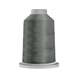 May include: A spool of gray thread, ideal for sewing and embroidery projects. The thread is tightly wound on a white base with a gray top. The thread is a solid, neutral color, suitable for various fabric types and designs.