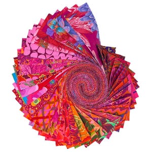 May include: A spiral of colorful fabric squares in shades of pink, red, orange, and purple. The fabric features various floral and abstract patterns. The arrangement creates a visually dynamic and artistic display, suitable for quilting or craft projects.