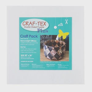 May include: A Craft-Tex Craft Pack with double-sided fusible material for crafts. The package features a sample quilted basket, a yellow butterfly, and text that reads "SIZE 20" x 36"", indicating the dimensions of the material.