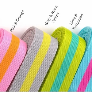 May include: A selection of colorful striped webbing rolls in various color combinations, including watermelon and plum, pink and orange, grey and neon yellow, lime and turquoise, pink and turquoise, and lavender and pink. The Bad Kitty Quilt Company logo is in the bottom right corner.