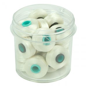 May include: A clear plastic container filled with multiple spools of white thread. Each spool has a teal-colored center. The thread is tightly wound, and the container is transparent, allowing visibility of the contents.