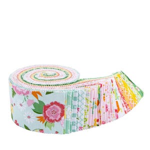 May include: A rolled bundle of fabric strips in a variety of floral and geometric patterns. The fabric features a color palette of pink, green, yellow, and blue. The strips are arranged in a spiral, with the edges of the fabric visible.