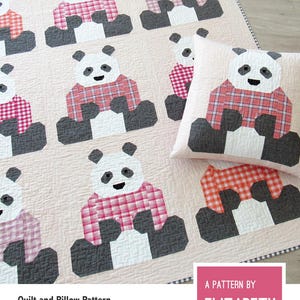 May include: A quilt and pillow pattern featuring panda bears wearing plaid sweaters. The pandas are in various poses on a light pink background. The text "PANDAS IN SWEATERS" is at the top.