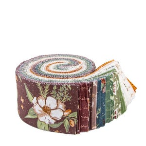 May include: Rolled fabric strips in a variety of floral and botanical patterns. The roll features a large white flower on a dark brown background. The fabric strips are in shades of green, brown, and white.