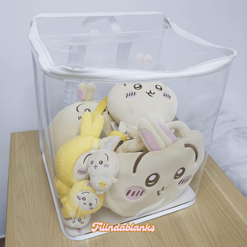 May include: A clear plastic storage bag with a zipper closure, filled with plush toys. The toys are various shades of yellow and cream and feature cartoon faces with brown eyes and pink cheeks.