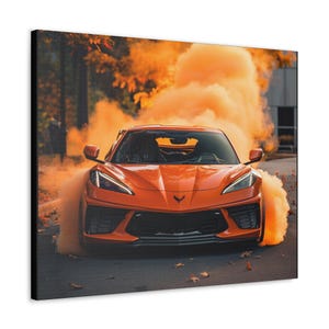May include: An orange sports car with black accents driving through a cloud of orange smoke. The car is in focus and the smoke is blurred.