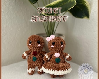 May include: Two brown crochet gingerbread figures with black bead eyes and pink cheeks. One figure wears a red and green button on its chest. The other wears a pink bow, a pink chest button, and a white skirt. Text reads CROCHET GINGERBREAD.