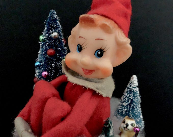 Kneehugger Elf on a Cocoa Tin Vignette