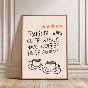 Peut inclure: Impression d'art encadrée avec un fond pêche clair. Le texte noir dit : "Barista was cute, would have coffee here again", avec cinq étoiles orange. Deux tasses à café sont dessinées en dessous.