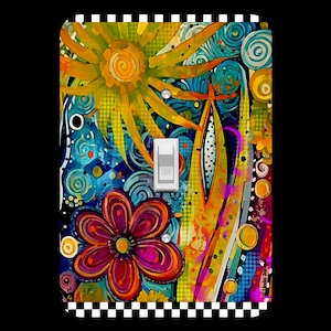 May include: A colorful light switch cover with a floral design featuring a large flower with red, purple, and orange petals, a yellow sun with a spiral in the center, and a blue and green background with swirls and dots. The switch cover has a black and white checkered border.