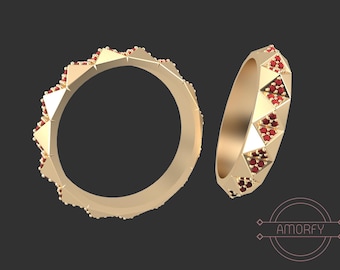 May include: A gold ring with a geometric design and red gemstones. The ring is shown from two different angles.