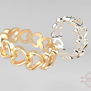 May include: Two rings, one gold and one silver, each featuring a continuous heart design. The gold ring is on the left, with the silver ring on the right. The rings are displayed on a light gray background. The brand name "AMORFY" is in the bottom right corner.