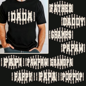 Op de afbeelding: Zwart T-shirt met het woord "DADA" in een wit camouflagepatroon. Extra ontwerpen zijn "FATHER", "DADDY", "GRAMPS", "PAPAW", "PAPI", "PAWPAW", "GRANDPA", "PAPPY", "PAPA" en "POPPOP".