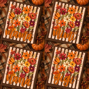 May include: Four rectangular fabric panels featuring a vertical striped pattern in brown and cream. Each panel displays a vibrant floral arrangement of orange, red, and white flowers with green leaves. The text mama, mimi, nana, and gigi is printed.