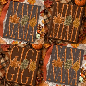 May include: A dark brown rectangular sign featuring the text MAMA, MIMI, GIGI, or NANA in white polka-dot lettering. Each sign displays three autumn leaves in orange, green, and yellow plaid patterns positioned between the letters of the name.