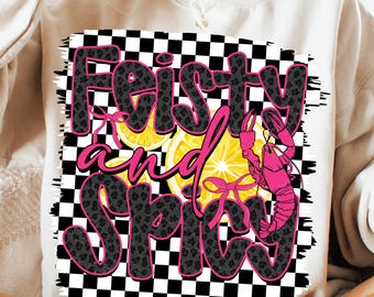 May include: A white sweatshirt with a black and white chequered background. The text "Feisty and Spicy" is written in black with a leopard print pattern. There are pink lemons and a pink crawfish on the design.