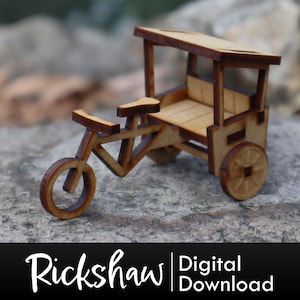 May include: A wooden model of a rickshaw with a canopy, a seat, and two wheels. The model is made of light brown wood and is about 6 inches long.