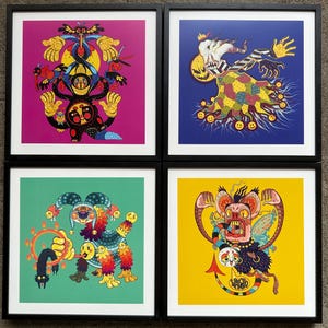May include: Four framed prints with colorful, whimsical illustrations of fantastical creatures. Each print features a different creature with a unique design and color scheme. The prints are framed in black and are displayed on a white wall.