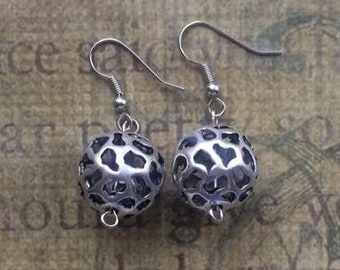 Silver toned drop hollow ball earrings