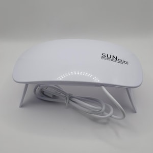 Travel size uv sun lamp- fast, even curing for gel dip nails!