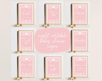 May include: Eight printable pink and white baby shower signs with a floral design and white text. The signs include: Food, Drinks, Favors, Cards & Gifts, Baby's First Book, Diaper Raffle, Babies are Sweet, Books & Gifts.