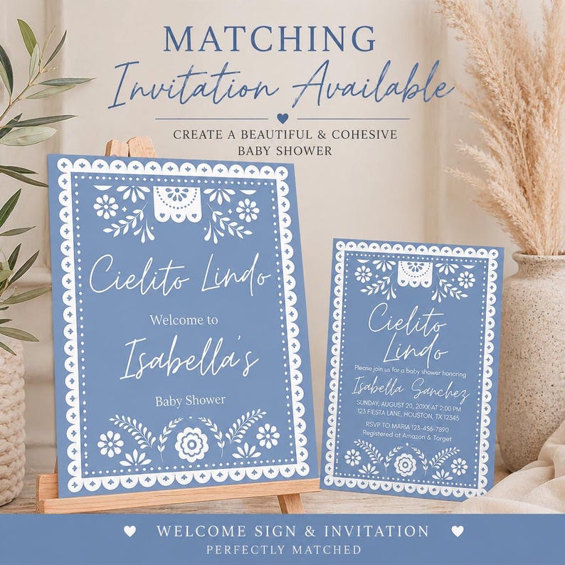 May include: A blue baby shower welcome sign and invitation with white floral and decorative border. The sign reads "Cielito Lindo" and welcomes Isabella to her baby shower. The invitation includes event details.