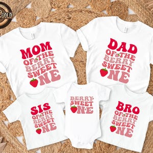 May include: White t-shirts and a onesie with matching text and strawberry graphics. The shirts read "MOM", "DAD", "SIS", and "BRO" with "OF THE BERRY SWEET ONE" in a retro font. The onesie says "BERRY SWEET ONE".
