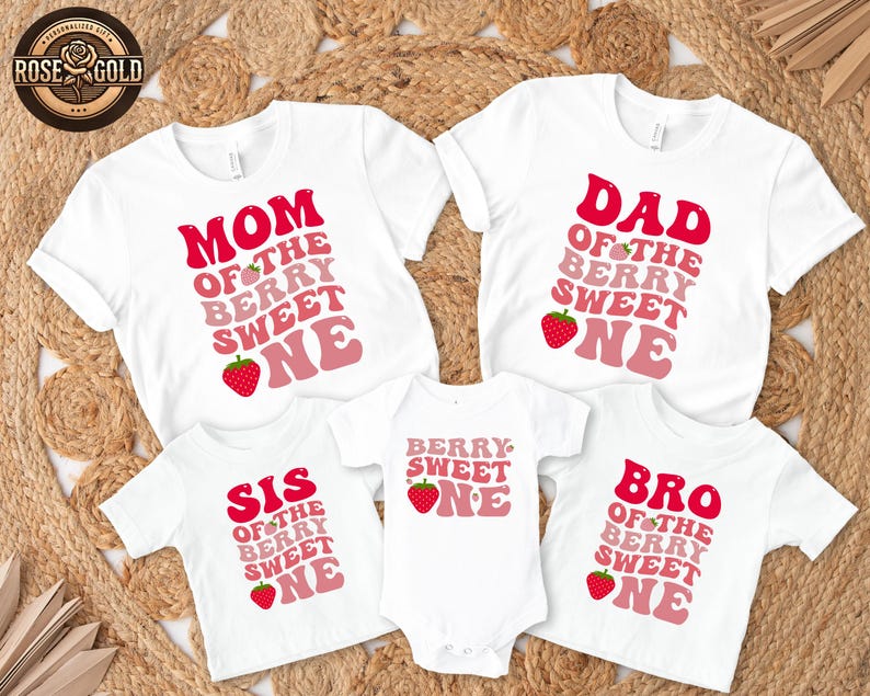 May include: White t-shirts and a onesie with matching text and strawberry graphics. The shirts read "MOM", "DAD", "SIS", and "BRO" with "OF THE BERRY SWEET ONE" in a retro font. The onesie says "BERRY SWEET ONE".