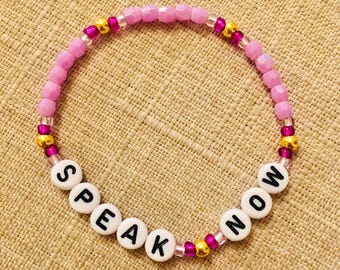 Pulsera de la amistad Speak Now morada y dorada (7 tallas)