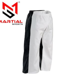 May include: Black and white martial arts pants. The pants are side-by-side, with the black pants on the left and the white pants on the right. The pants have an elastic waistband. The logo "MARTIAL SPORTS" is in the upper left corner.