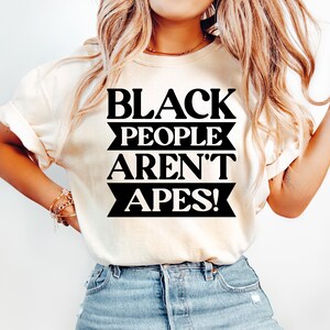 May include: A white ceramic mug with a colorful floral design. The mug features a handle and a glossy finish. The flowers are in shades of pink, purple, and yellow. The mug is likely for hot beverages.