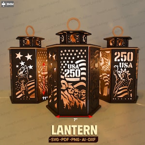 May include: Three hexagonal black lanterns with cut-out designs featuring the Statue of Liberty, Mount Rushmore, stars, stripes, and the text USA 250. The lanterns measure 11 inches in height and 7 inches in width, with a material thickness of 3mm.