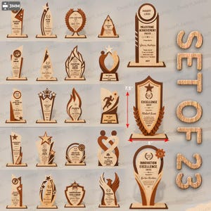 May include: A collection of twenty-three wooden awards and trophies featuring various shapes, including shields, flames, and stars. The items display engraved text and logos, with some showing a 7.5 inch by 5 inch measurement indicator.