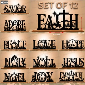 May include: A set of 12 black laser-cut wooden word signs featuring nativity scenes integrated into letters. Words include SAVIOR, FAITH, ADORE, PEACE, LOVE, HOPE, HOLY, NOEL, JESUS, NOEL, JOY, and EMMANUEL. Dimensions are 9.5-10.5 inches wide and 3.5-4.5 inches tall.