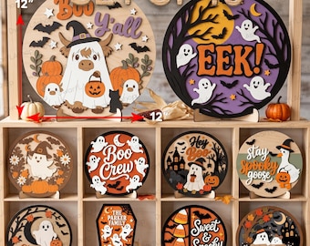 Può includere: Un set di 10 insegne di Halloween in legno, circolari e a forma di bara, di 30,48 cm di diametro e 3 mm di spessore. Le insegne presentano ritagli a strati di fantasmi, zucche, pipistrelli e testi come Boo Y'all, Eek, Boo Crew e Hey Boo.