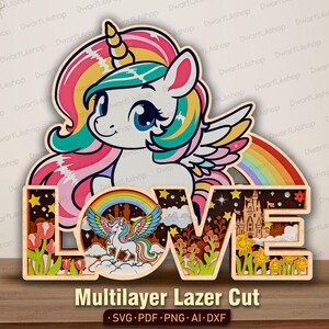 Könnte beinhalten: Ein mehrschichtiges Holzkunstwerk mit einem Einhorn mit Regenbogenmähne und Flügeln, einem Regenbogen und dem Wort "LOVE". Das Design umfasst Tulpen, ein Schloss und Sterne. Der Text "Multilayer Lazer Cut" befindet sich unten.