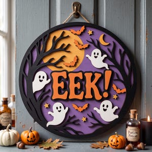 May include: A circular wooden wall sign featuring the text EEK! in orange letters. The design includes a purple background, a yellow moon, black tree silhouettes, white ghosts, orange bats, and yellow stars. It hangs from a brown twine loop.