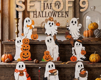 May include: A set of 9 wooden ghost decorations for Halloween, each featuring a white ghost with various accessories like pumpkins, books, hats, and lanterns. The figures are displayed on tiered wooden shelves, with some items measuring 7 inches by 8 inches.