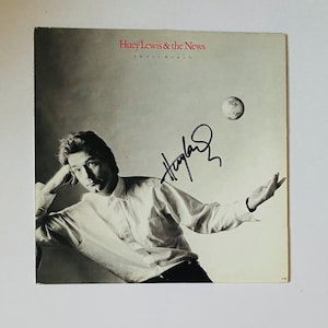 Huey Lewis Autograph on  LP Sleeve With COA