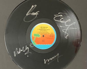 Autógrafo de U2 en disco de vinilo original con certificado de autenticidad