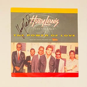 Huey Lewis Autograph on 12 Inch Record Sleeve With COA