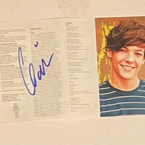 CD autografiado de One Direction con certificado de autenticidad y firma de Liam Payne