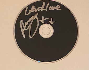 CD autografiado por Amy Winehouse con certificado de autenticidad